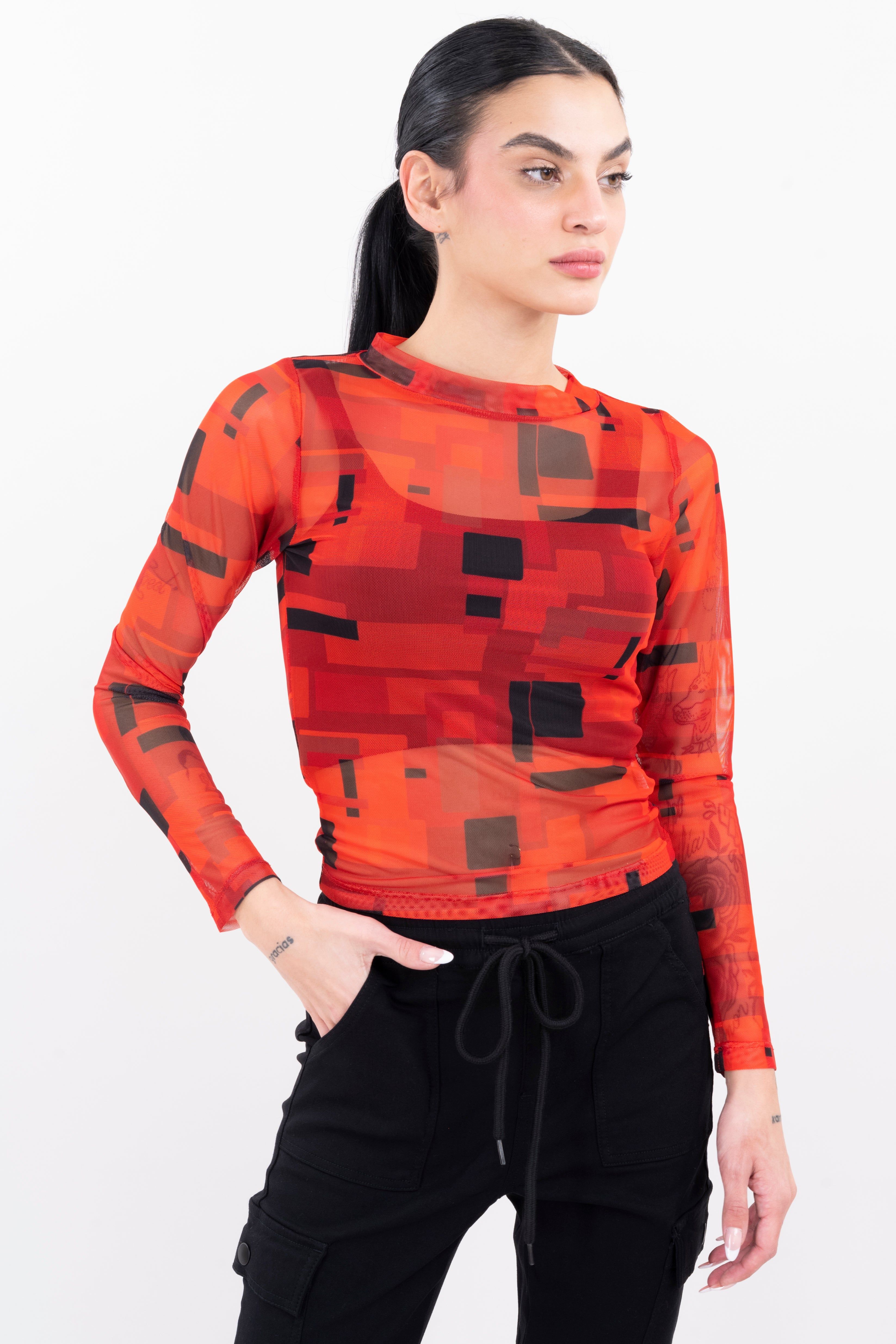 Top mesh manga larga estampado sold by Shasa