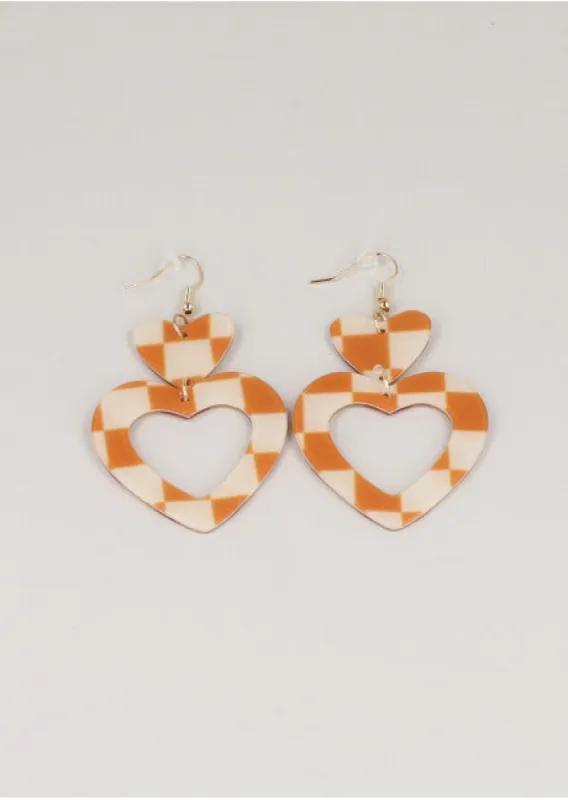 Aretes corazón cuadros sold by Shasa