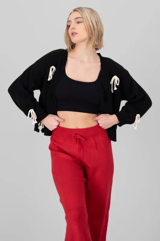 Cardigan tejido moños sold by Shasa