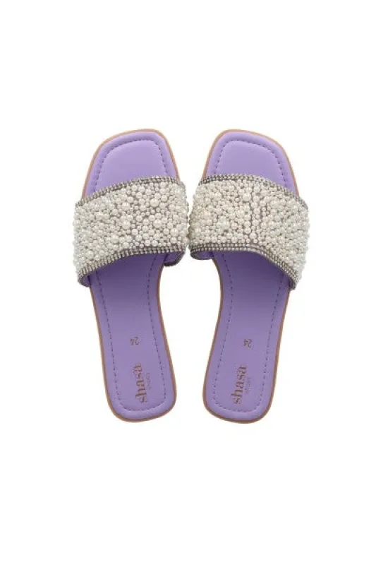 Sandalias pala aplicaciones perlas sold by Shasa