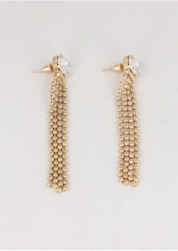 Aretes largos brillo sold by Shasa