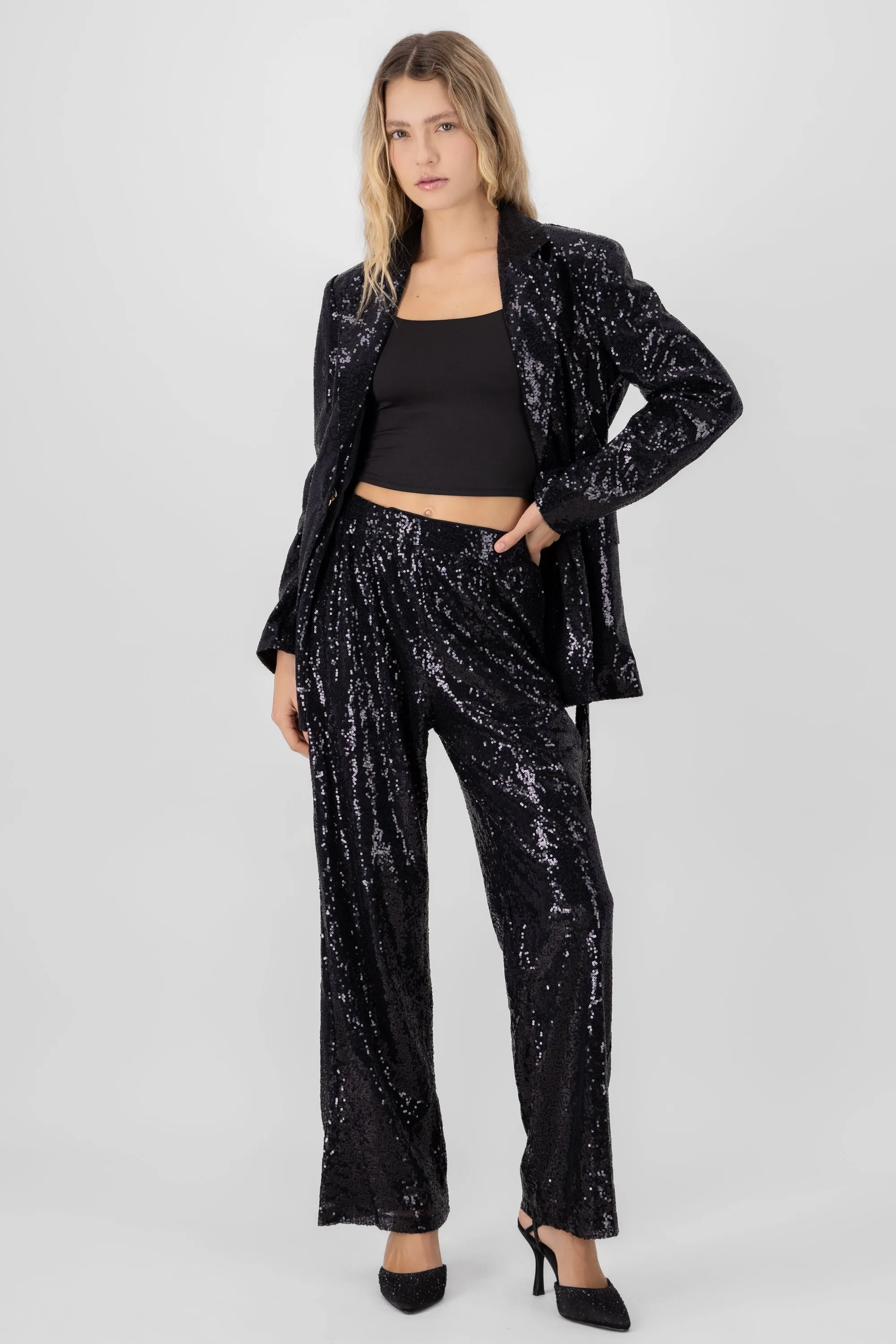 Pantalon fluido brillos sold by Shasa