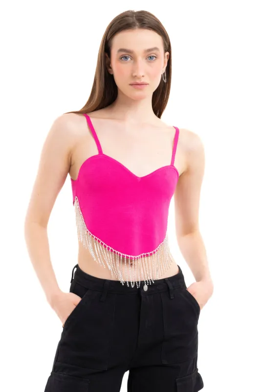 Top crop bajo asimétrico brillos sold by Shasa