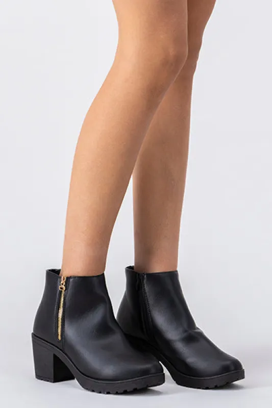 Botín cierre lateral suela track sold by Shasa