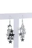 Aretes estrellas colgantes sold by Shasa