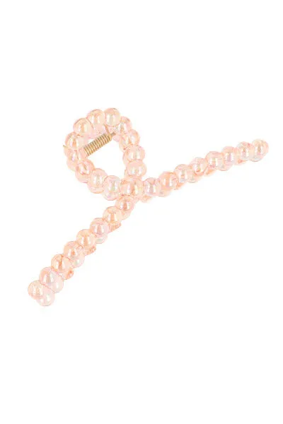 Pinza larga nudo círculos sold by Shasa