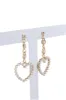 Aretes midi corazones perlas sold by Shasa