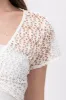 Top crop eyelet aro sold by Shasa