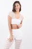 Top crop eyelet aro sold by Shasa