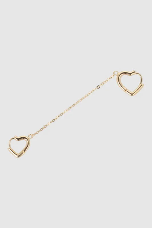 Arete doble corazones sold by Shasa