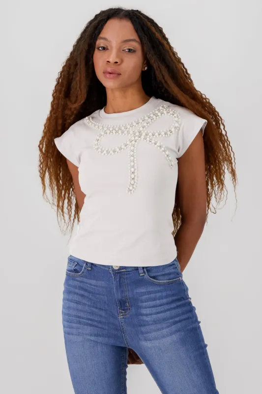 Playera manga corta detalle moño perlas sold by Shasa