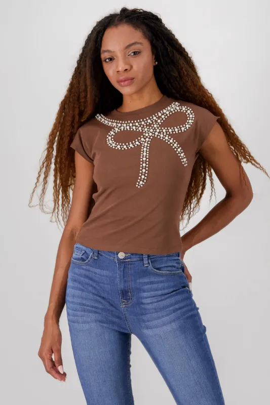 Playera manga corta detalle moño perlas sold by Shasa