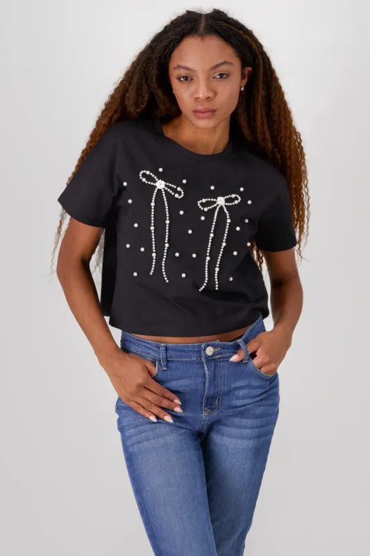 Playera manga corta detalle moños perlas sold by Shasa