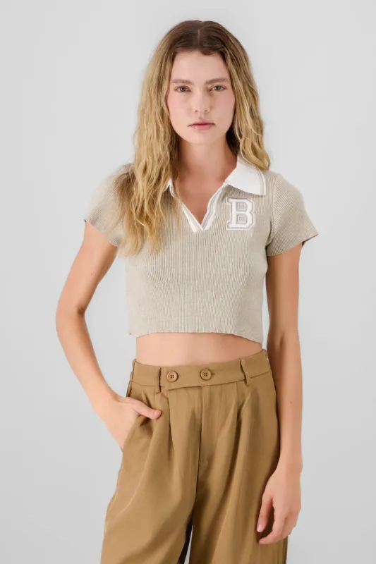 Top tejido polo detalle parche sold by Shasa