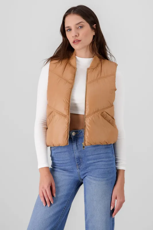 Chaleco mini puffer liso con bolsas sold by Shasa