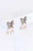 Aretes Mariposa Brillos Perlas sold by Shasa