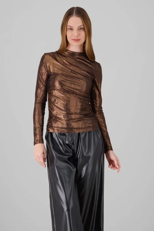 Blusa manga larga metalica sold by Shasa