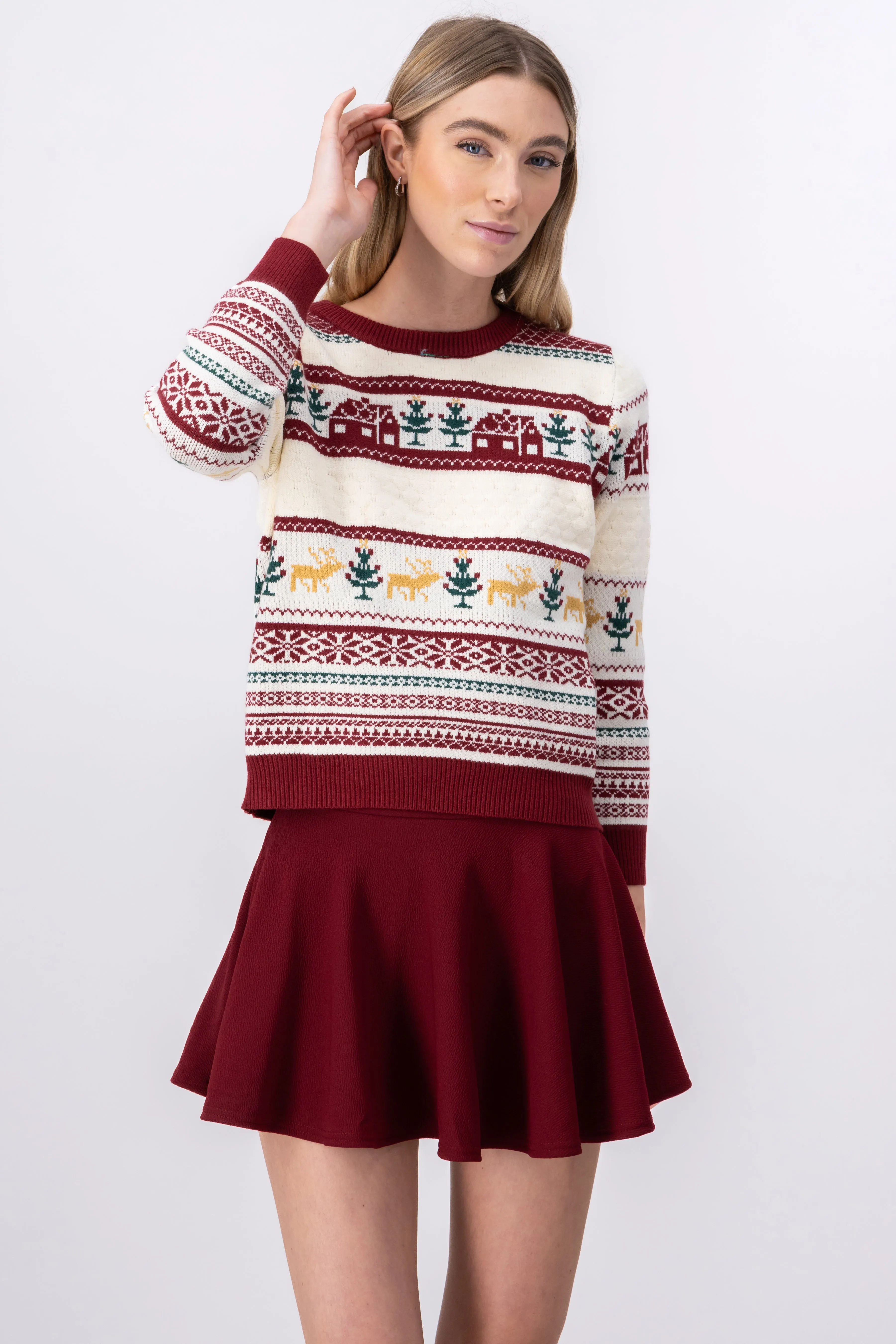 Suéter navideño casitas sold by Shasa