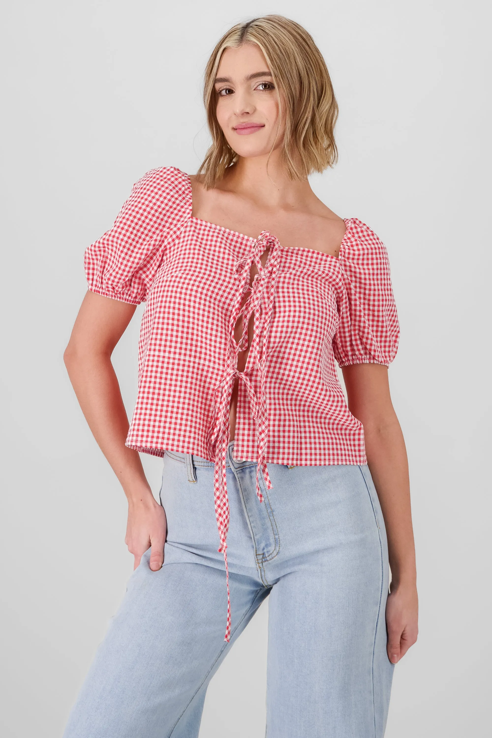 Camisa de mangas abullonadas y lazos al centro sold by Shasa