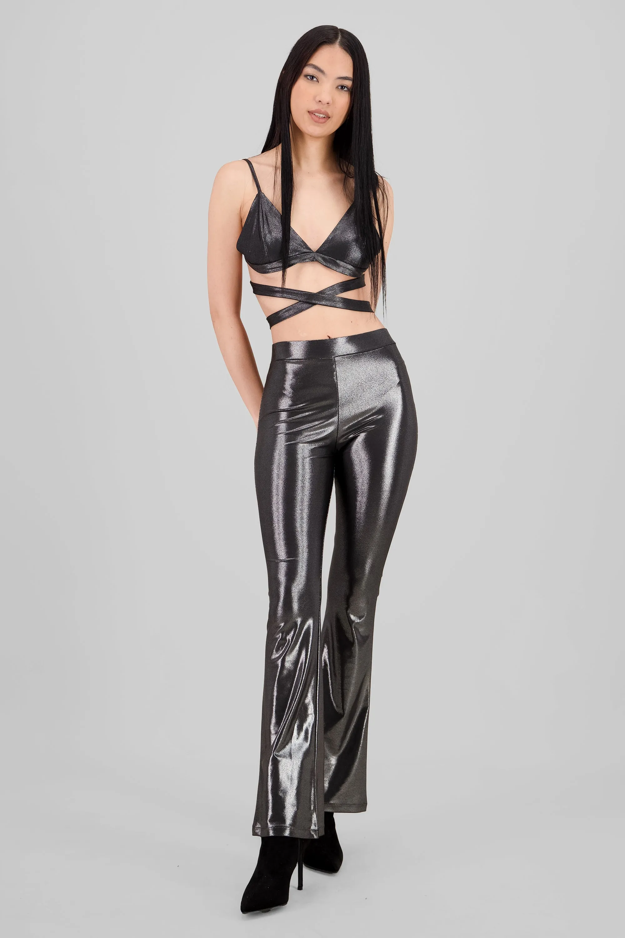 Pantalon flare brillos sold by Shasa