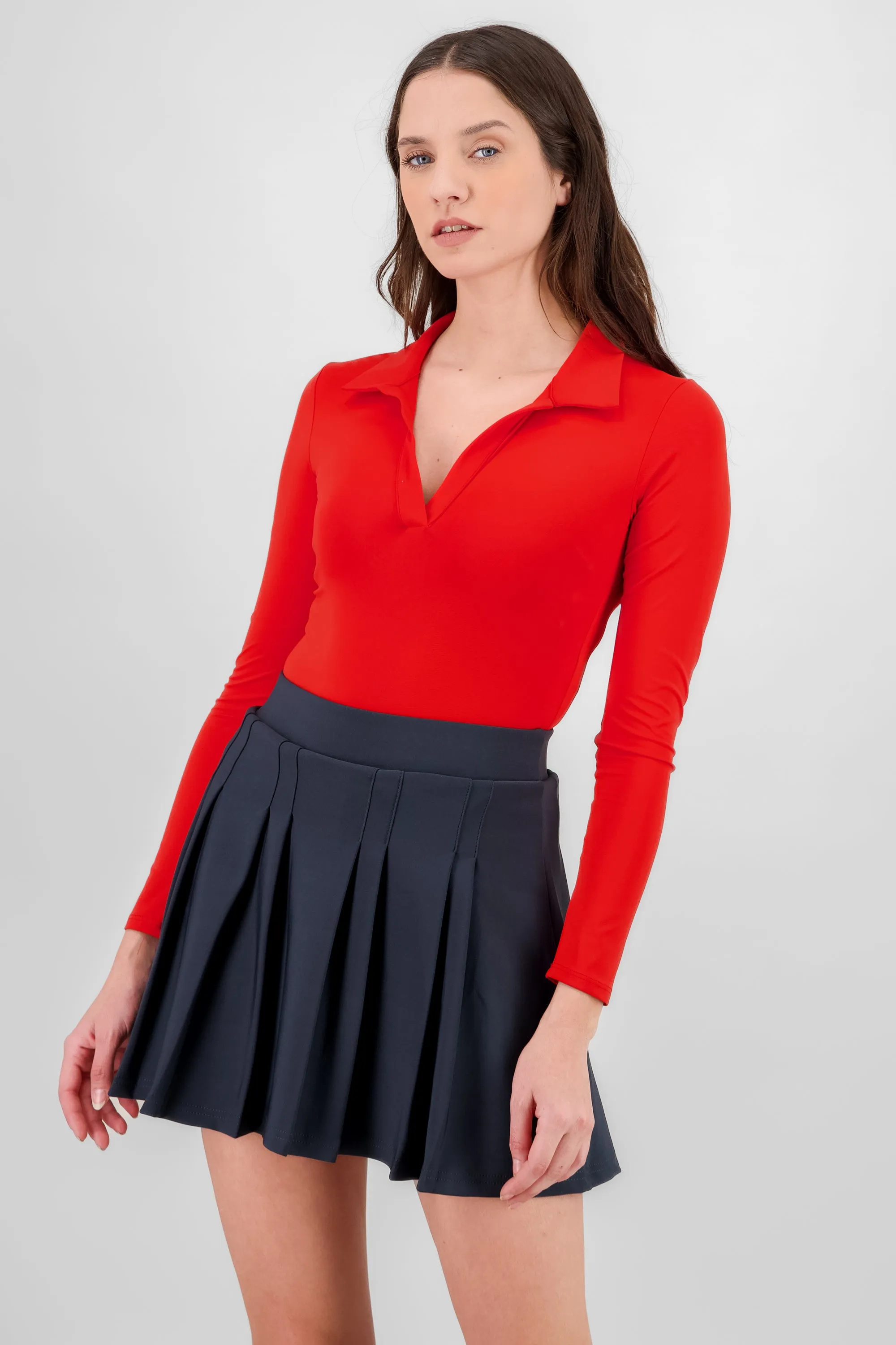 Body manga larga cuello polo sold by Shasa