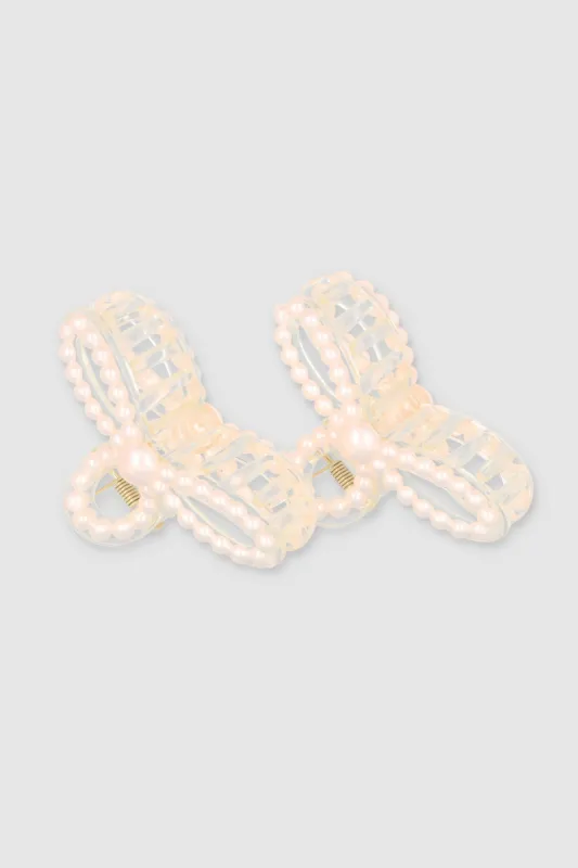 Set 2 pinzas perla moño sold by Shasa