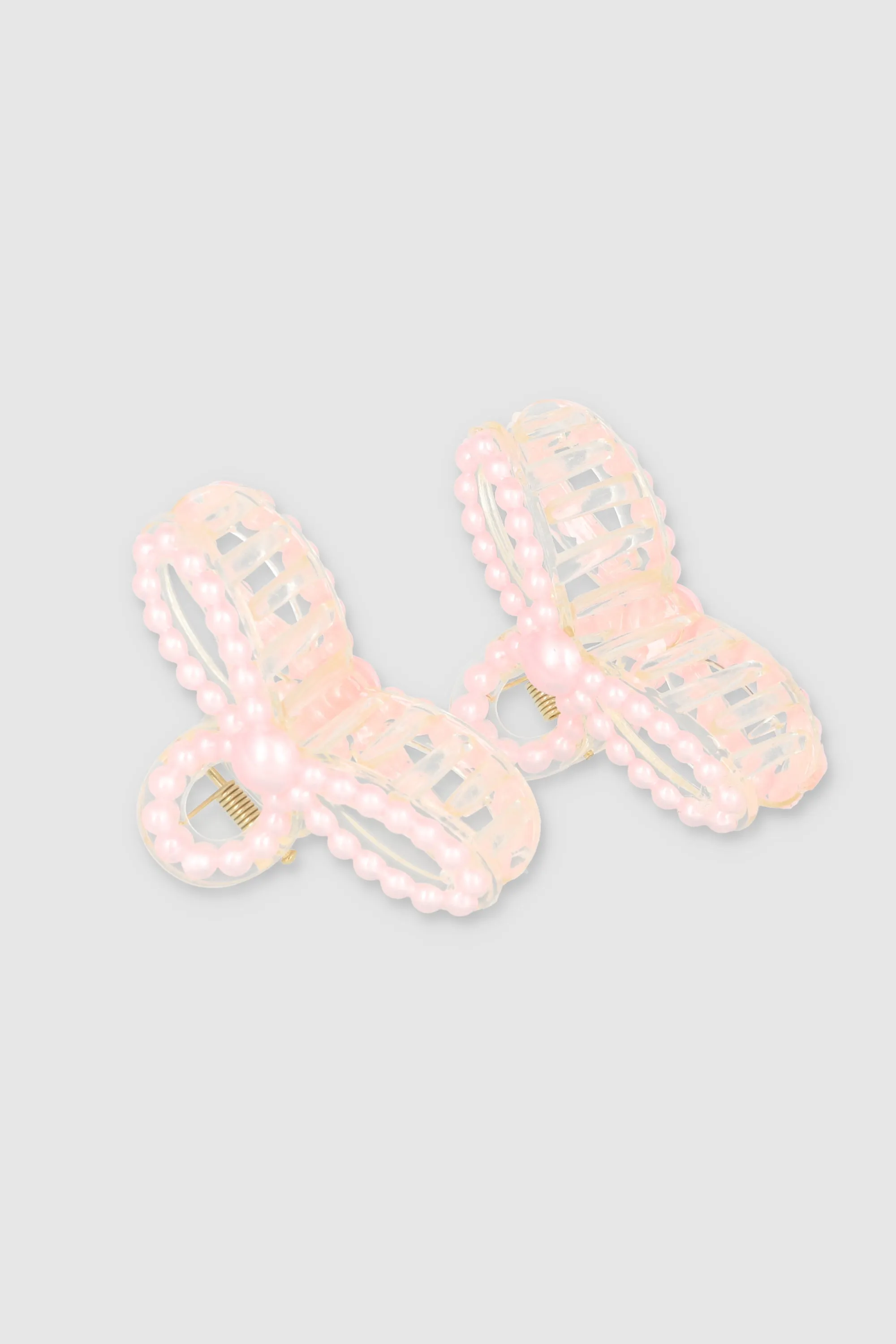 Set 2 pinzas perla moño sold by Shasa