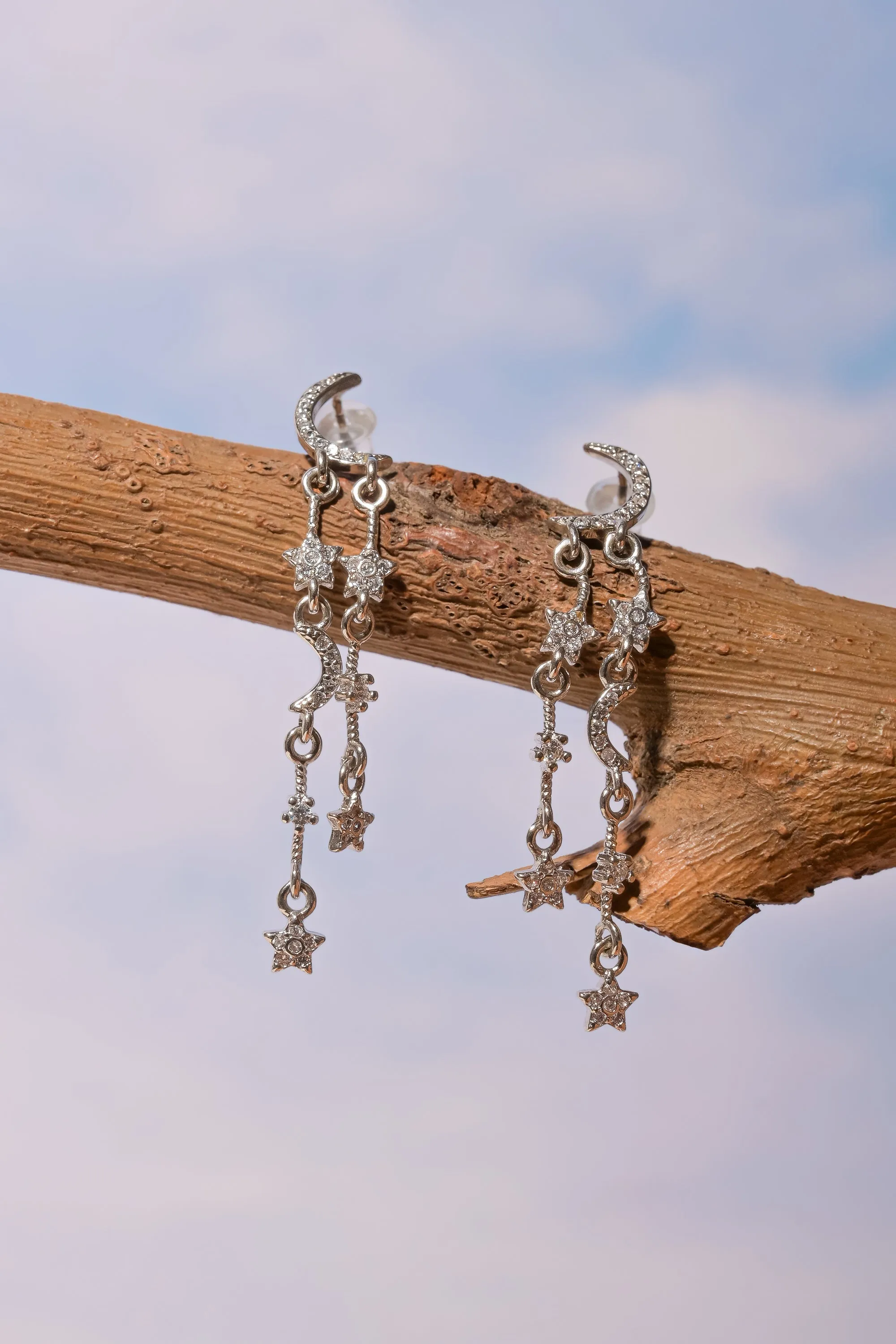 Aretes luna brillos sold by Shasa