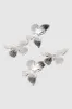Aretes doble mariposas sold by Shasa
