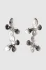 Aretes doble mariposas sold by Shasa
