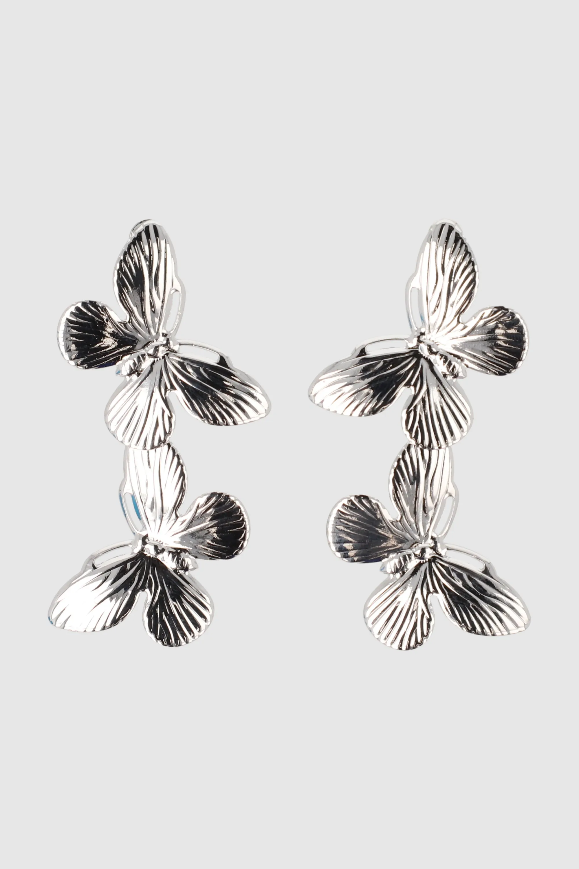 Aretes doble mariposas sold by Shasa product image thumbnail 3