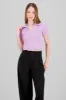 Top crop manga corta cuello polo sold by Shasa
