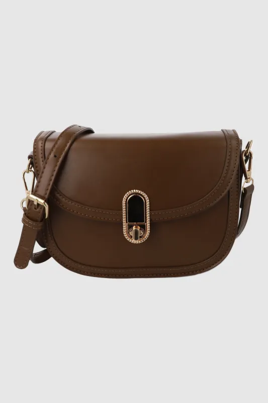Bolsa crossbody tapa broche sold by Shasa