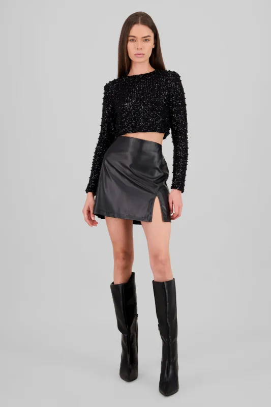 Falda mini vinipiel detalle abertura sold by Shasa