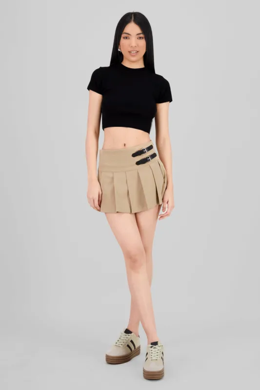 Mini falda lisa tableada dos hebillas sold by Shasa