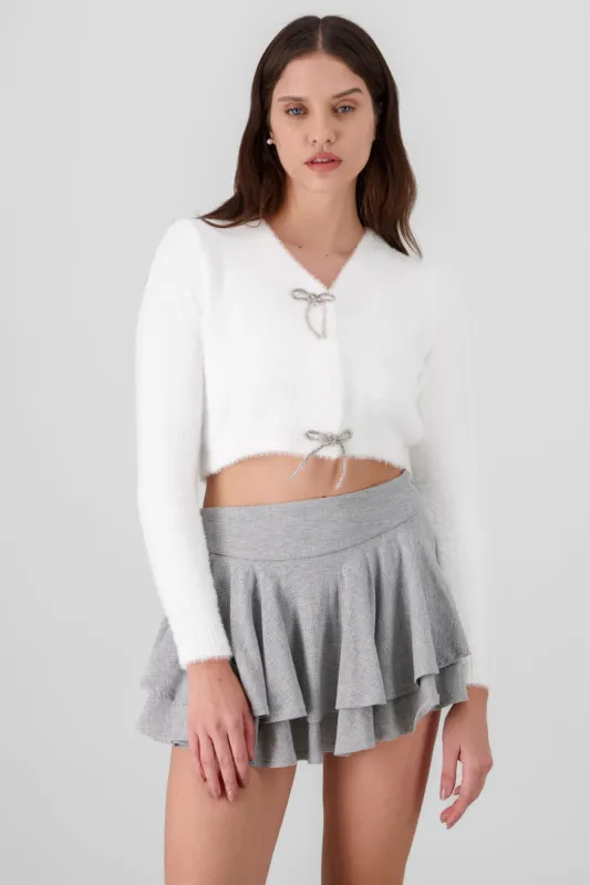 Cardigan botones moños brillos sold by Shasa