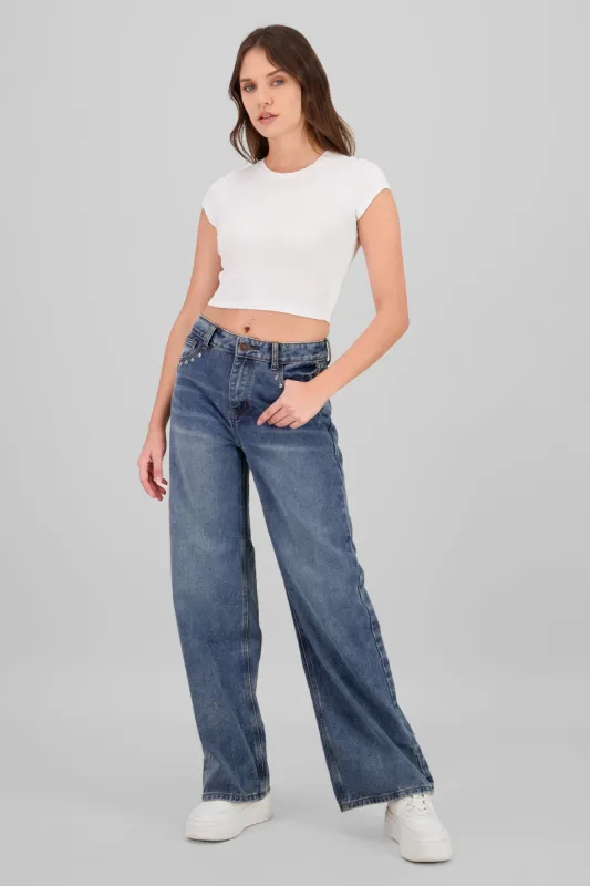 Jeans wide leg con estoperoles sold by Shasa