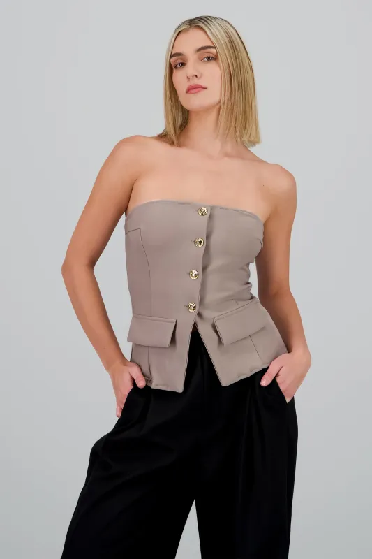 Top formal con bolsas y accentos de botones sold by Shasa