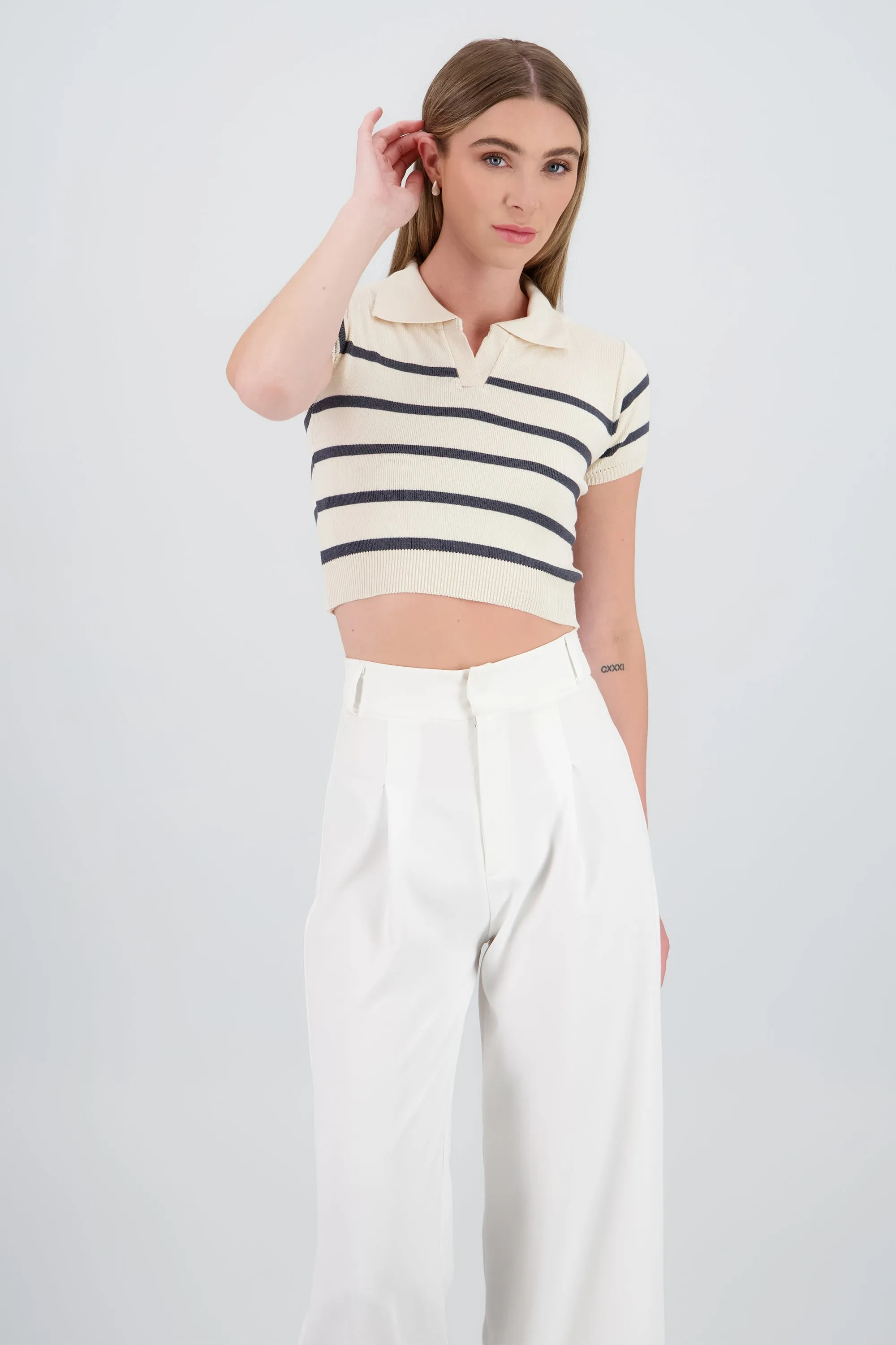 Top tejido cuello polo rayas sold by Shasa