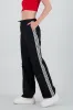 Pantalones lisos rayas nylon sold by Shasa