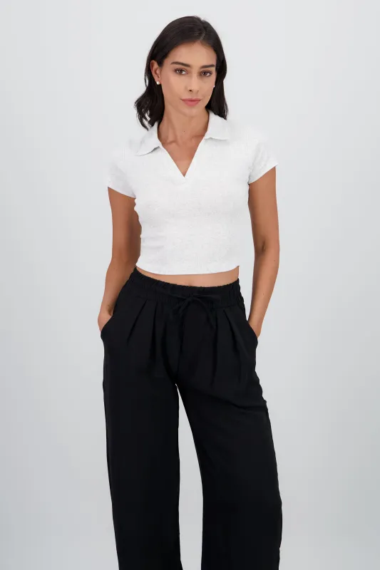 Top de manga corta con cuello polo textura sold by Shasa