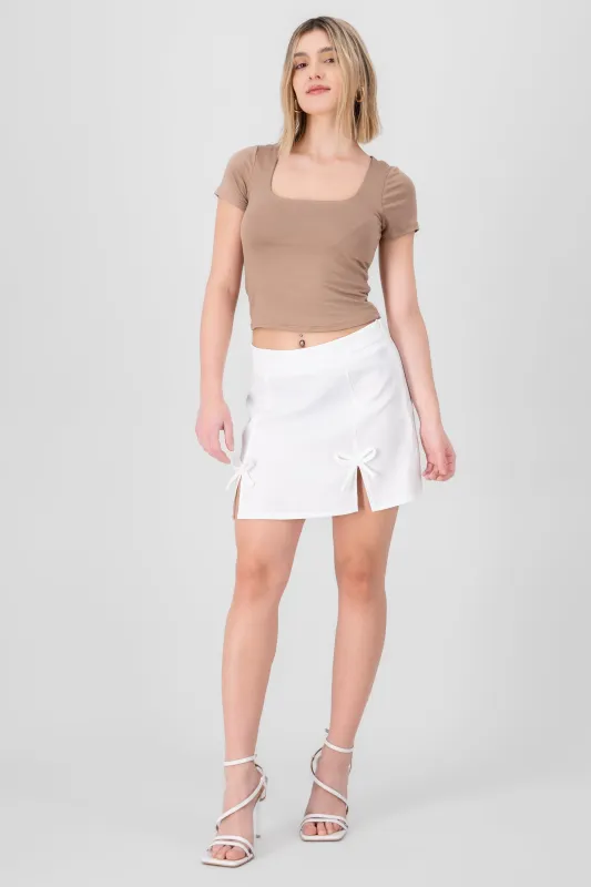 Mini falda aberturas moños sold by Shasa