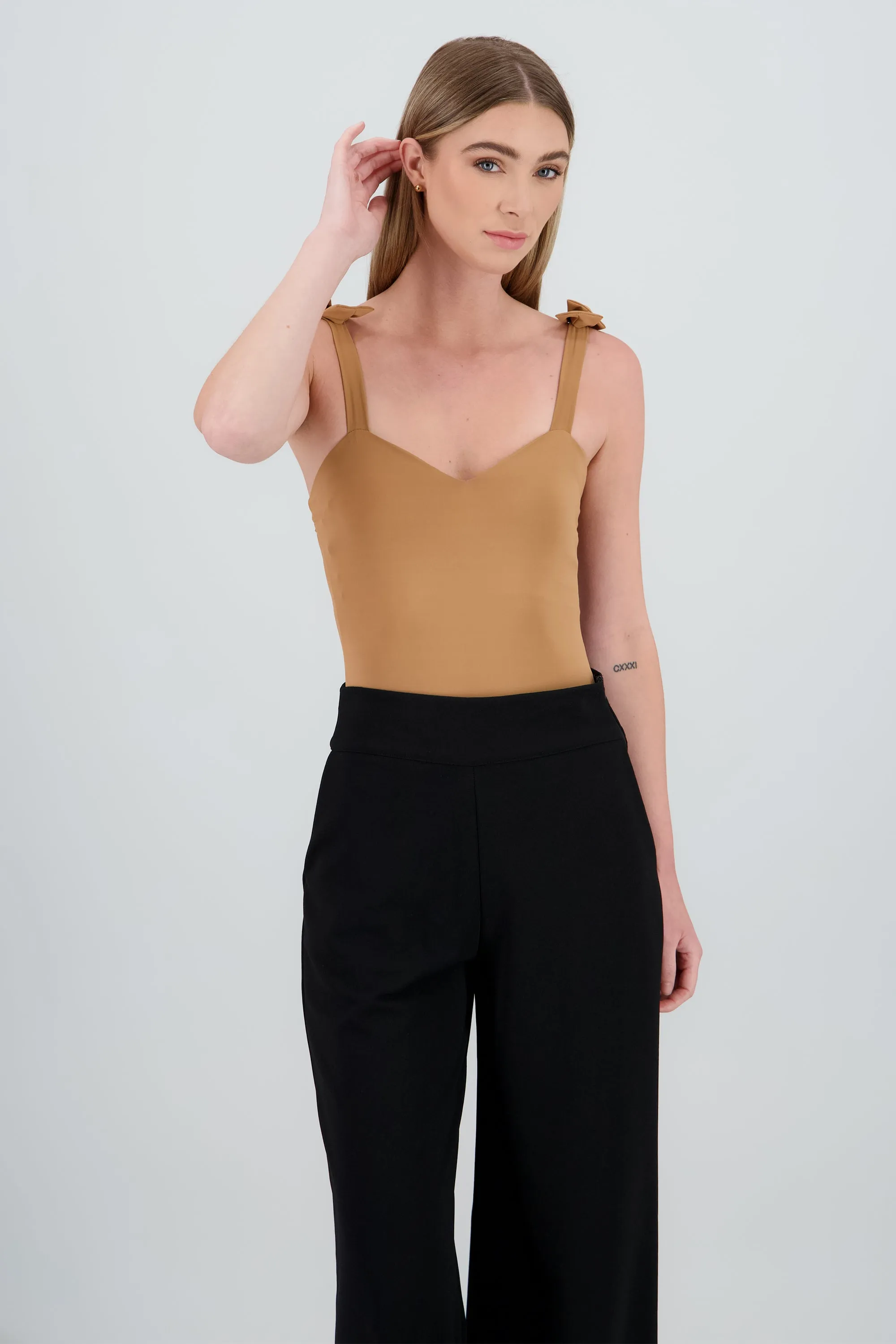 Bodysuit Liso Con Tirante Moños Hypsters sold by Shasa