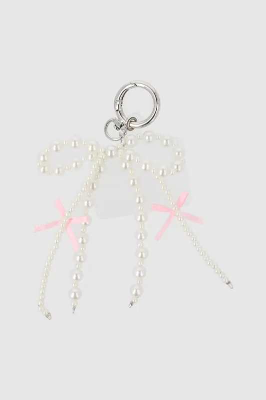 Charm para cel doble moño perla sold by Shasa