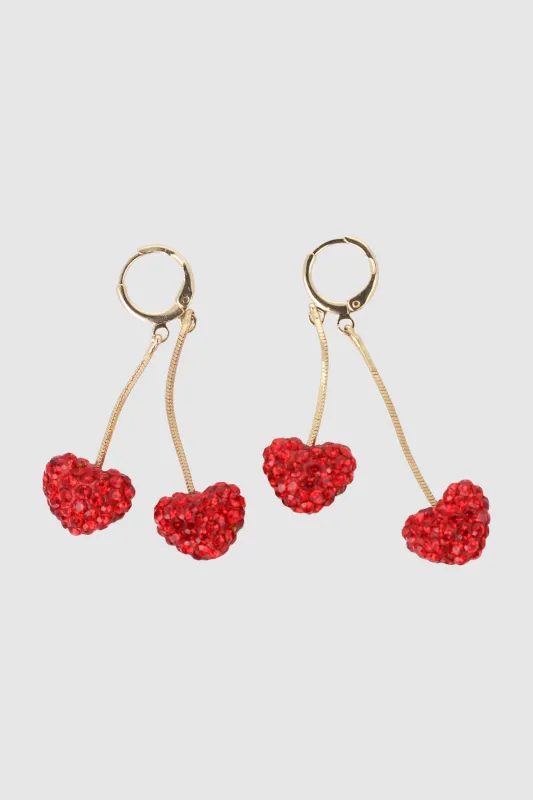 Arracadas 2 corazones glitter sold by Shasa