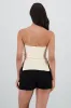 Top strapless con textura sold by Shasa
