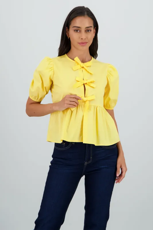 Blusa mangas abullonadas detalle moños sold by Shasa