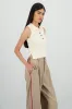 Top tejido cuello polo sin mangas sold by Shasa