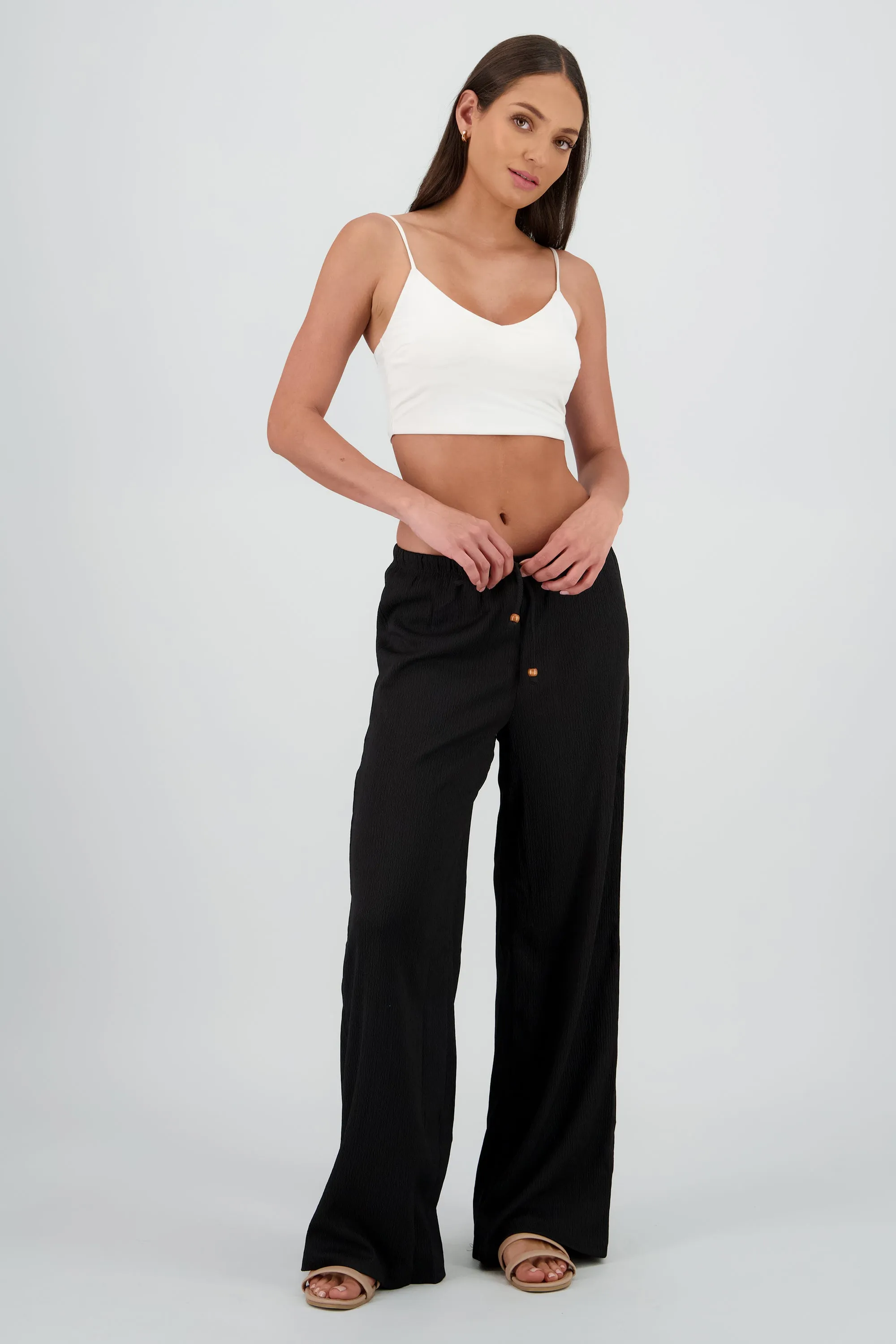 Pantalon amplio jaretas detalle cuentas sold by Shasa