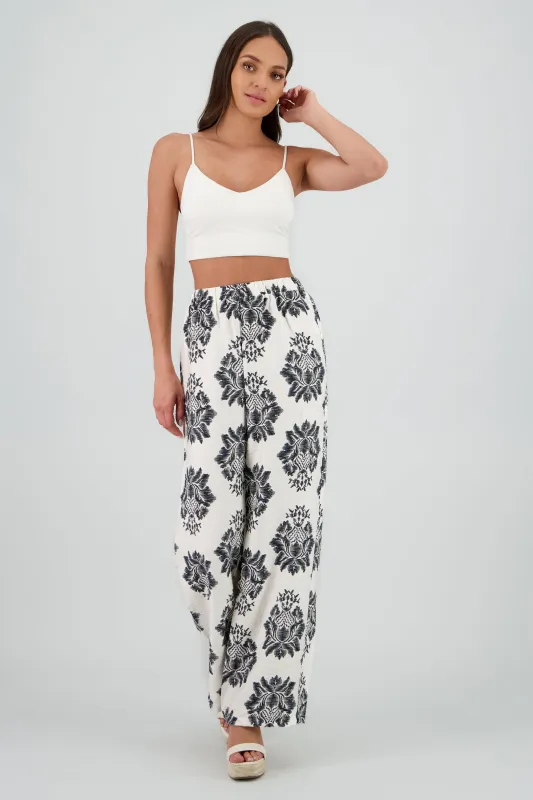 Pantalones fluidos estampado tropical sold by Shasa
